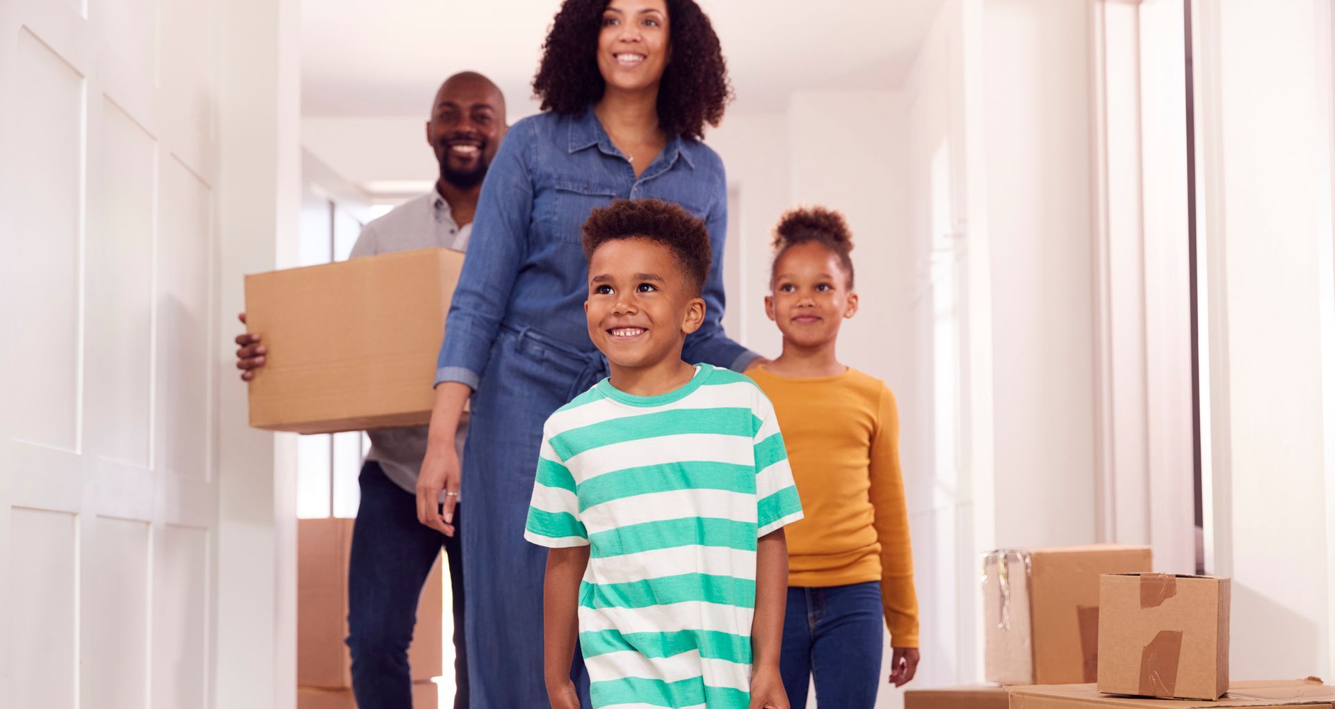 children-helping-parents-to-carry-boxes-into-new-h-2026-01-05-06-30-17-utc
