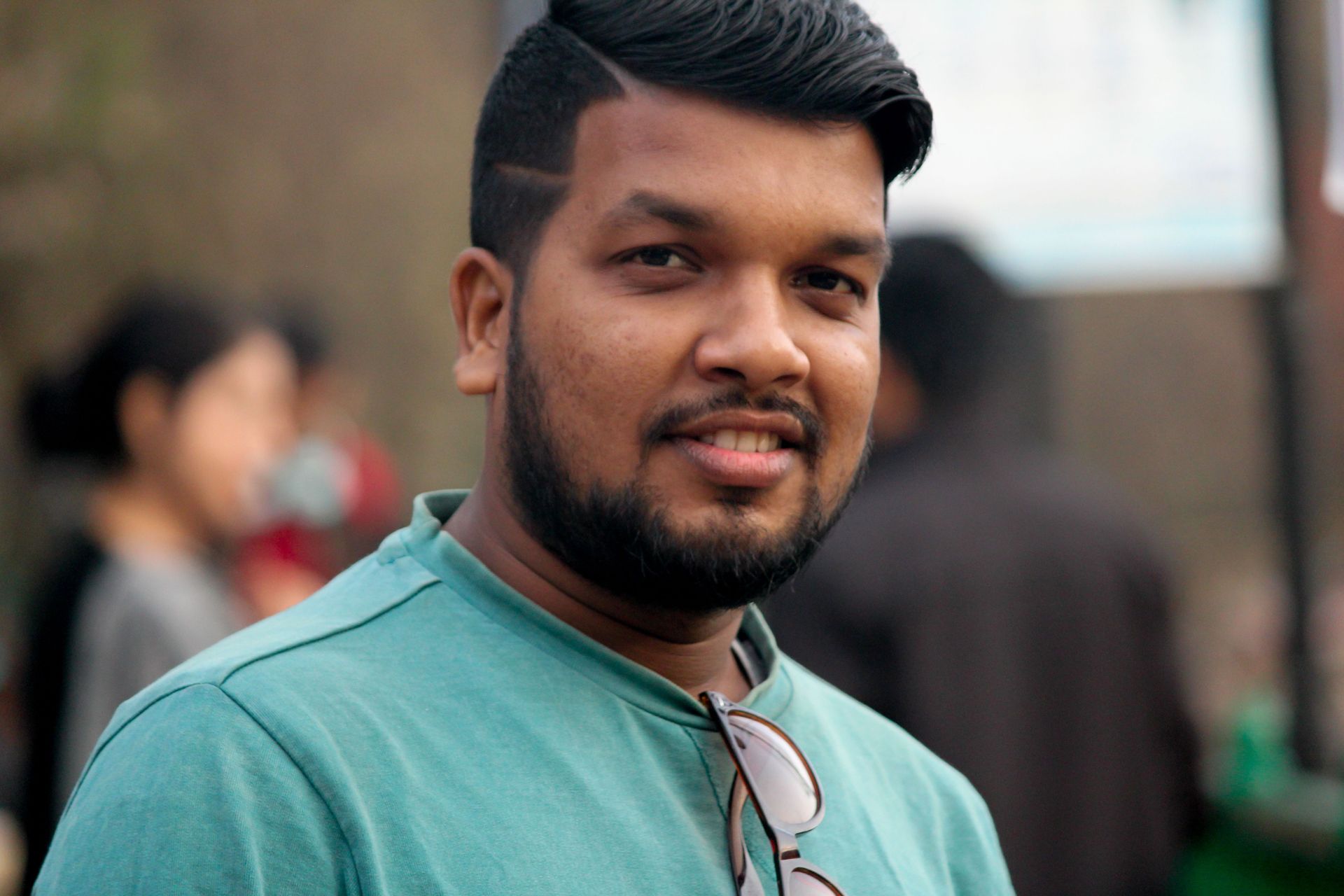 indian-male-stands-facing-the-camera-while-smiling-2026-01-07-07-23-55-utc