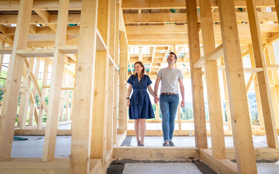 loving-couple-at-construction-site-of-their-new-ho-2026-03-10-22-26-58-utc