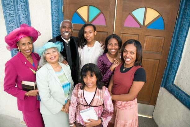 A group of people are posing for a picture in front of a church door.- Lancaster, TX - International Harvest Fellowship Ministries