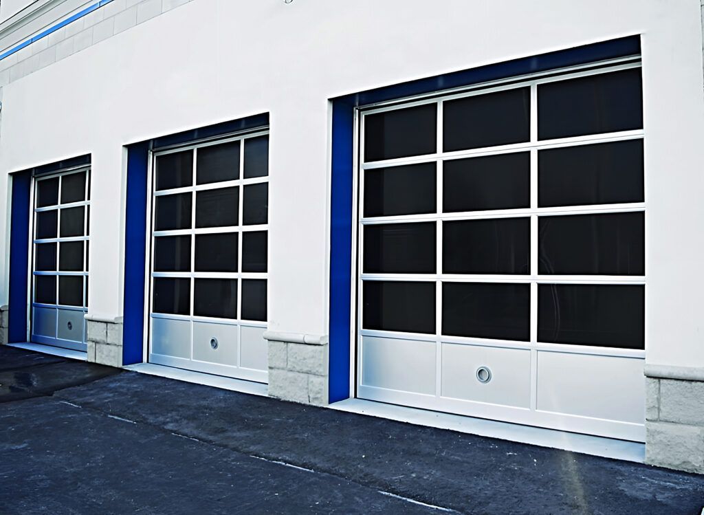 A row of garage doors on a white building
