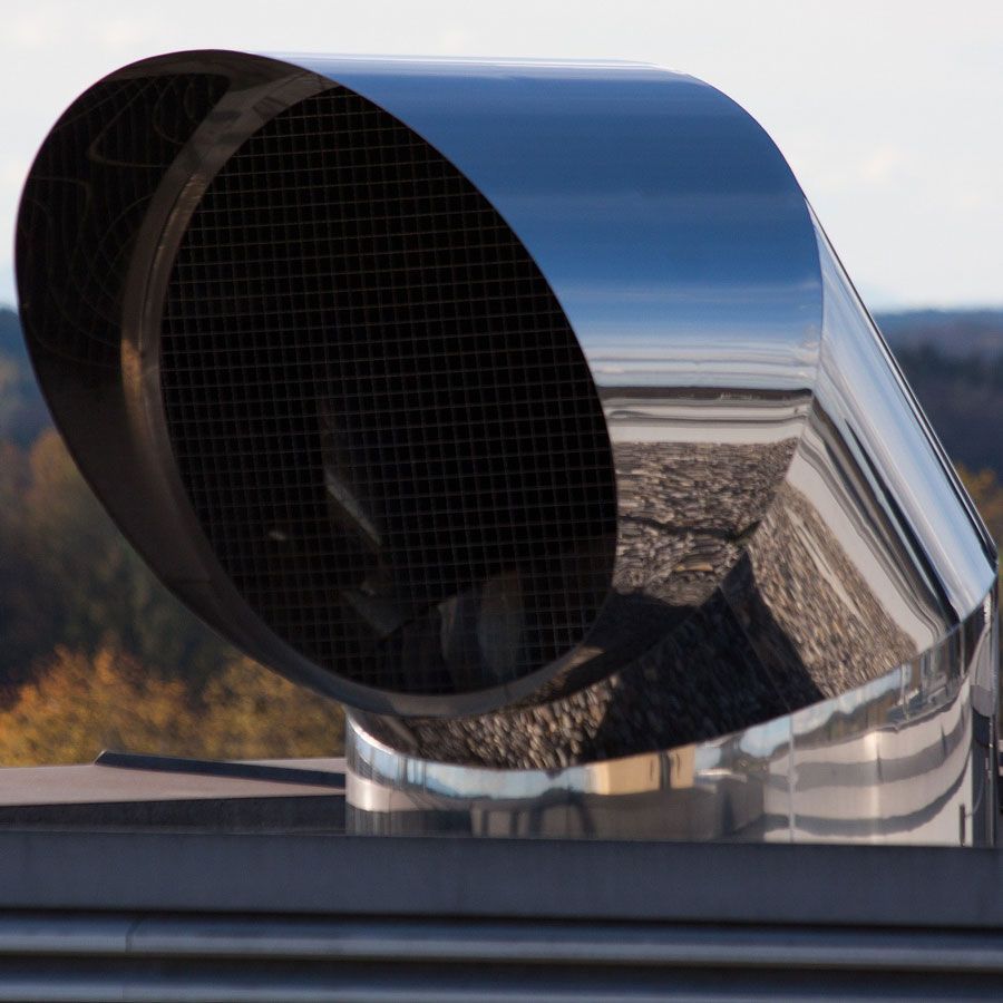 A close up of a stainless steel exhaust pipe