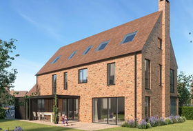 Brick house with a long brown roof, windows, and a chimney; two children on the lawn.