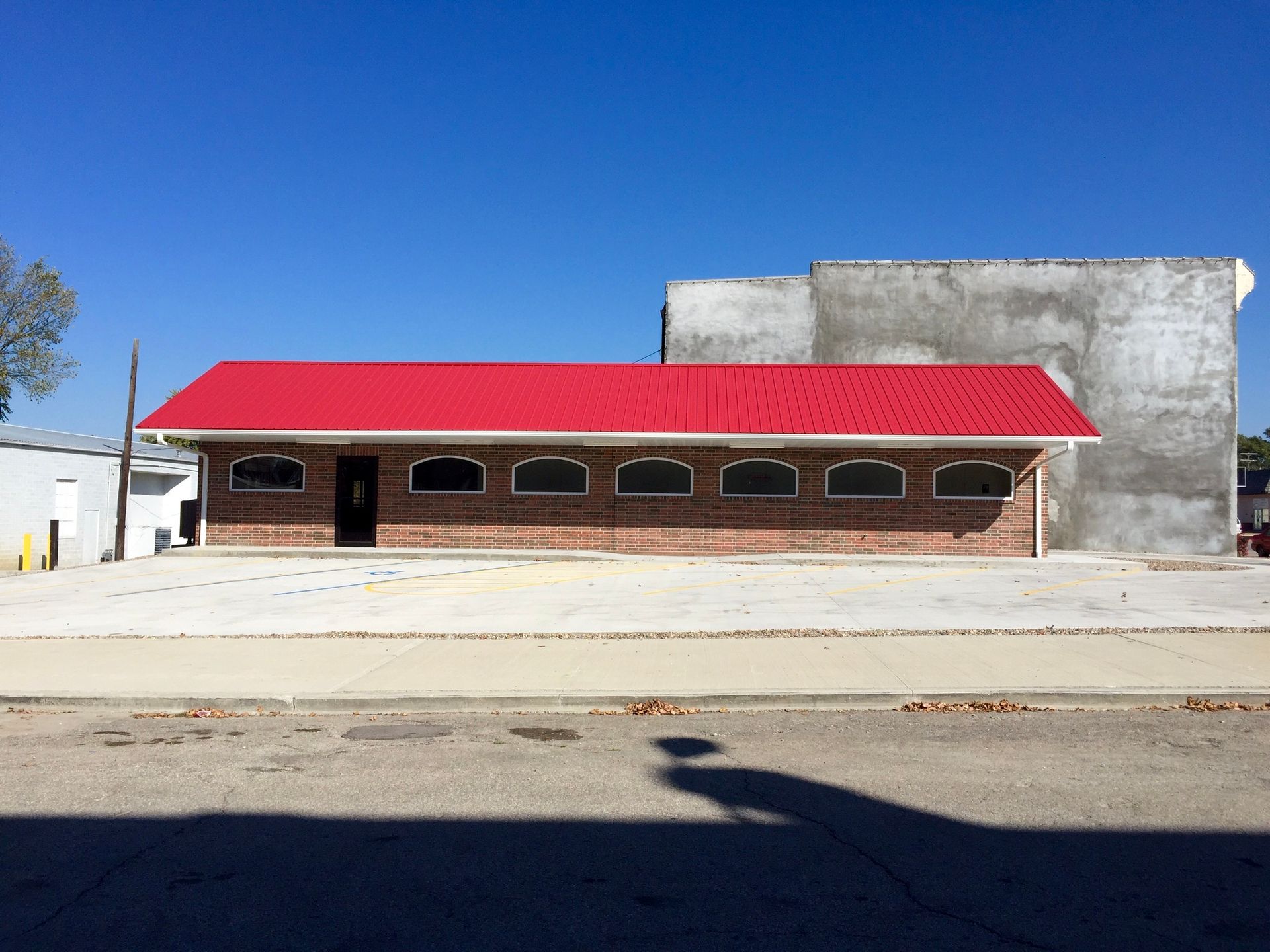 A large brick building with a red roof