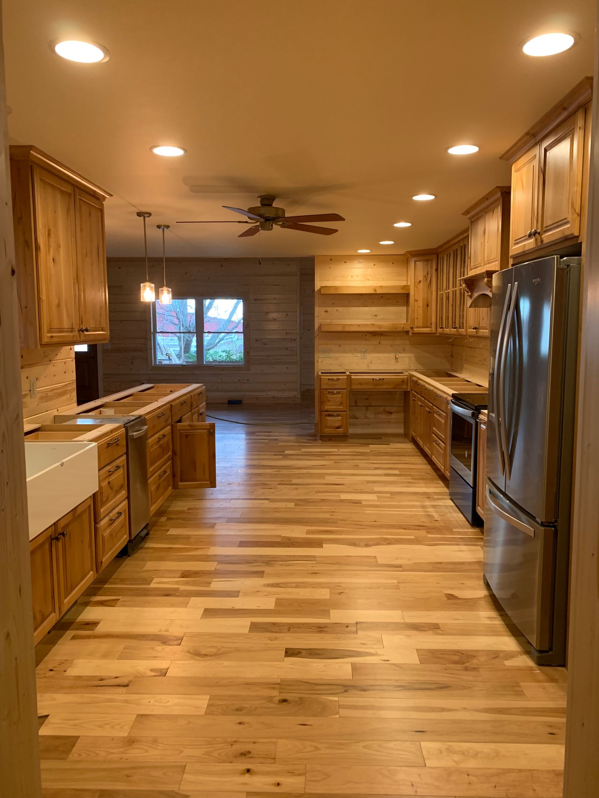 A kitchen with wooden cabinets and stainless steel appliances.