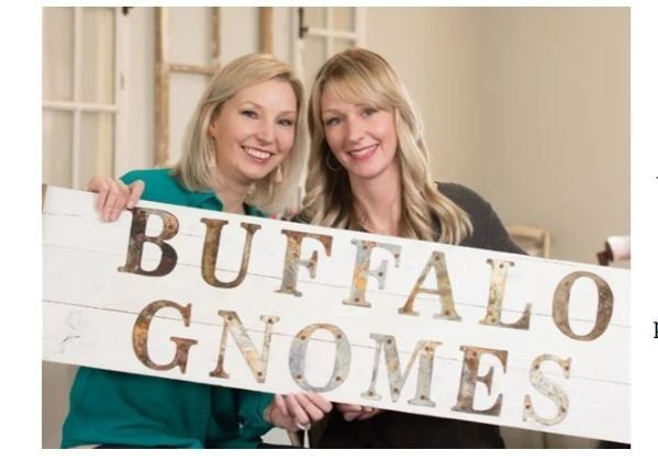 Two Women Happy Holding Rustic Buffalo Signage