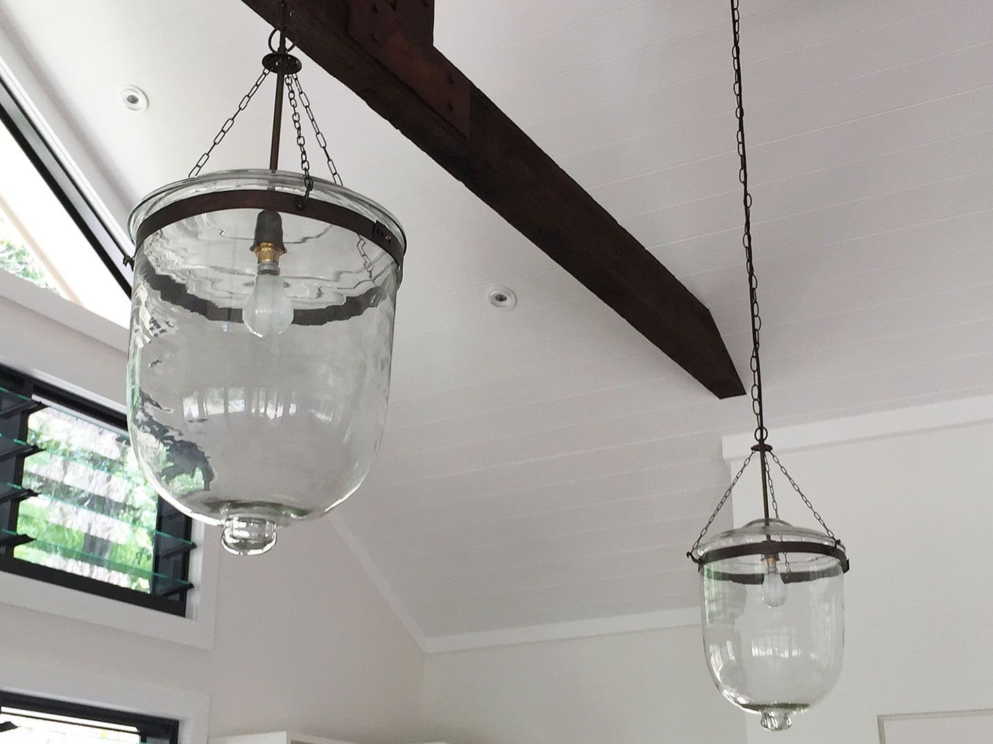 Two clear glass lanterns are hanging from the ceiling — Sigley Electrical in Mooball, NSW