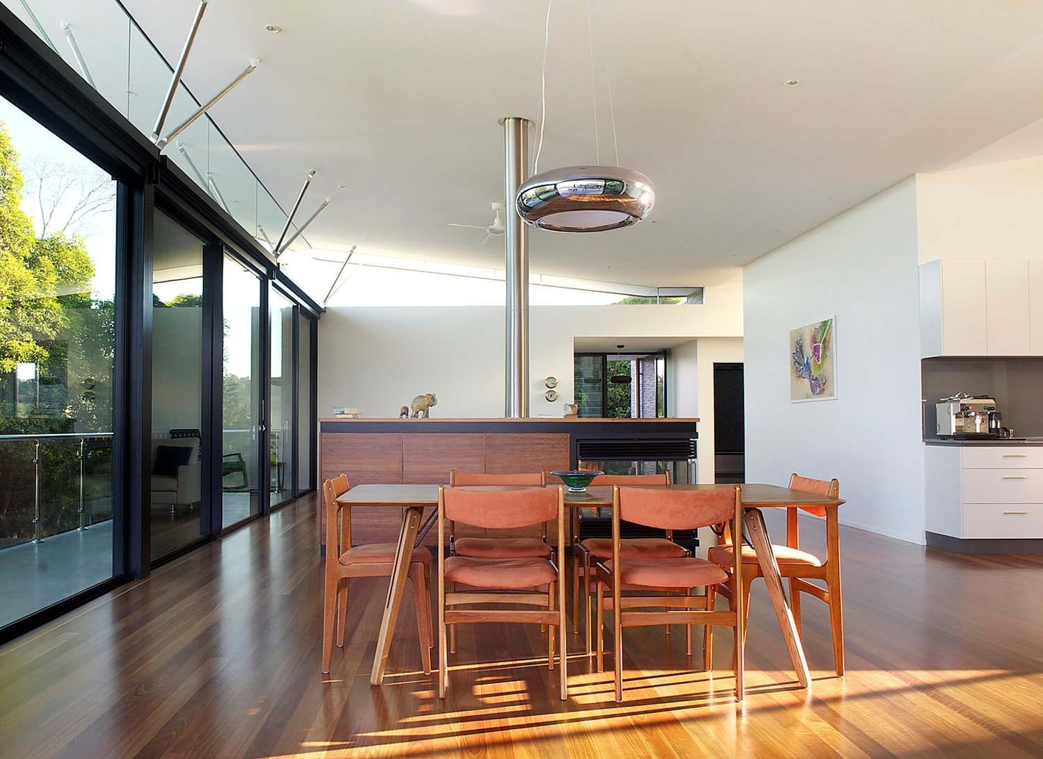 A Dining Room in a House With a Table and Chairs — Sigley Electrical in Mooball, NSW