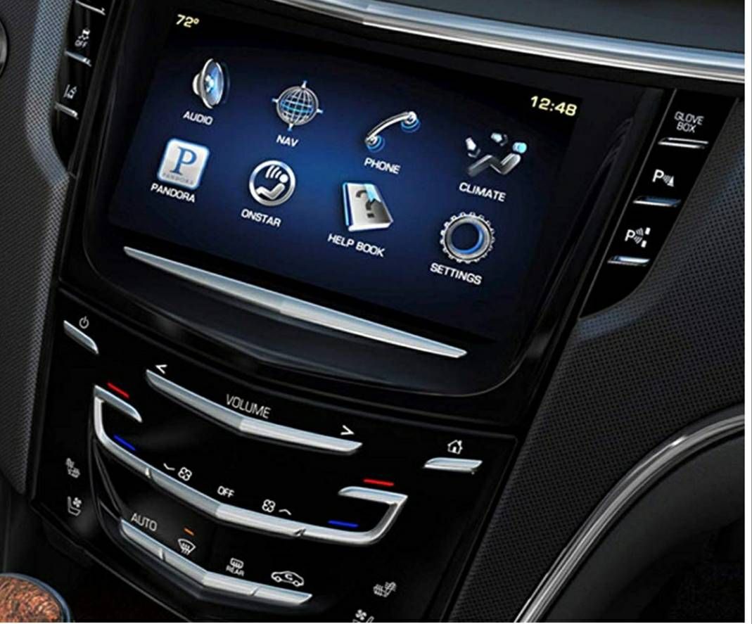 A close up of a car dashboard with a touchscreen