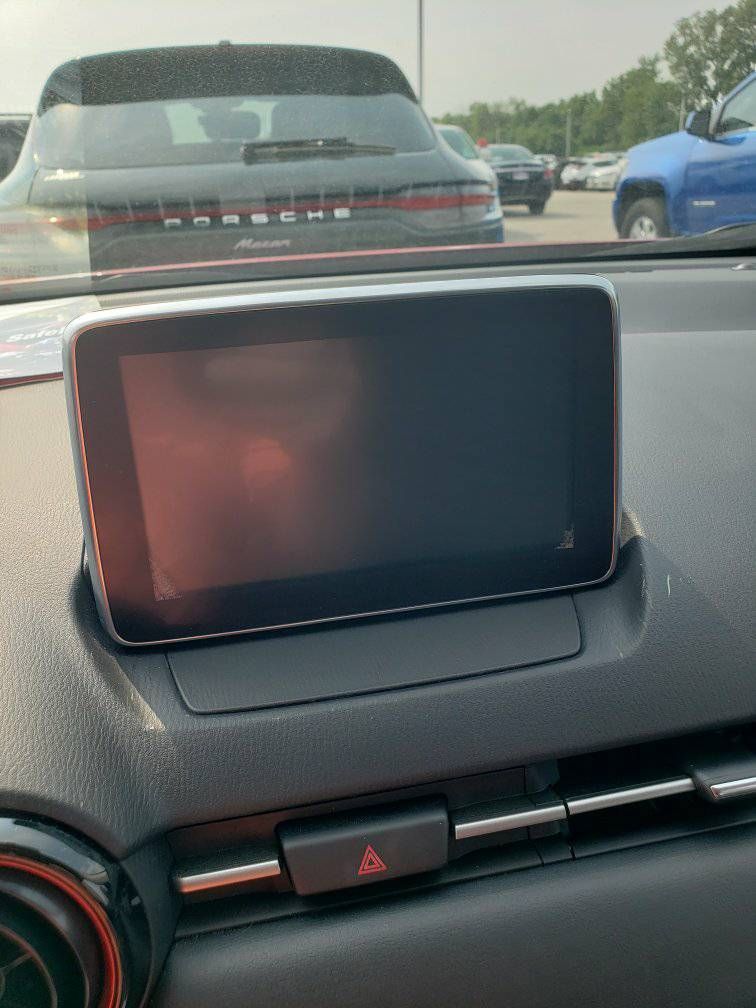 The dashboard of a car with a touchscreen display.