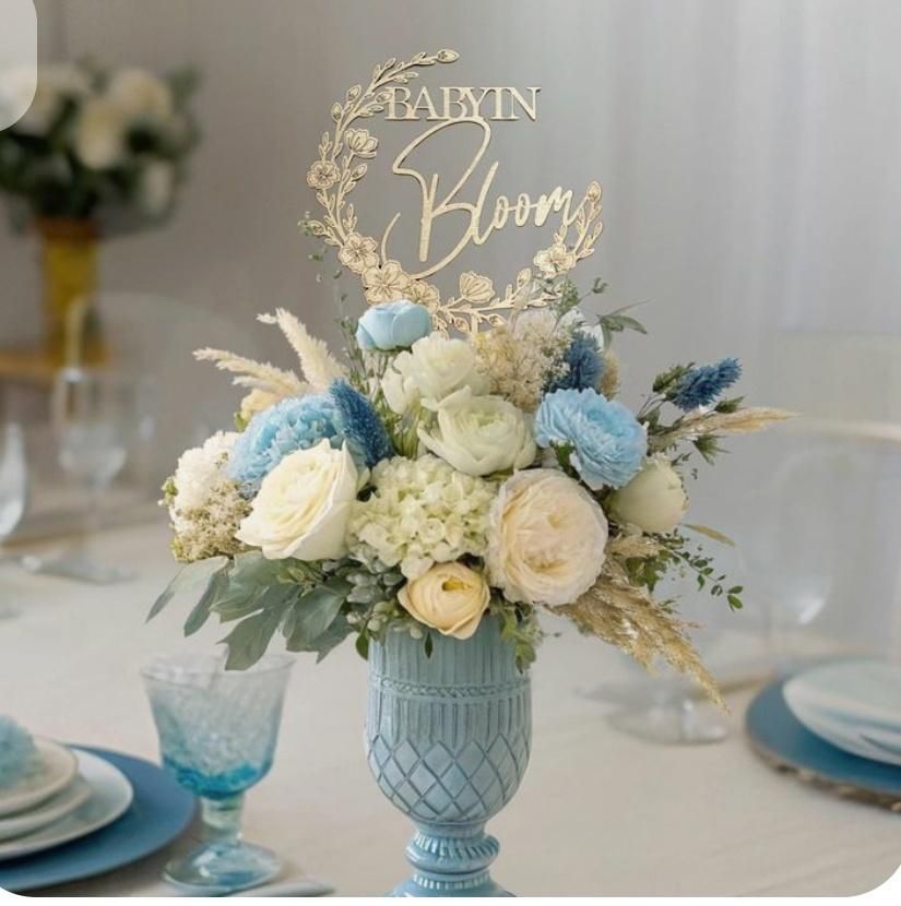 Floral arrangement in a blue vase with a