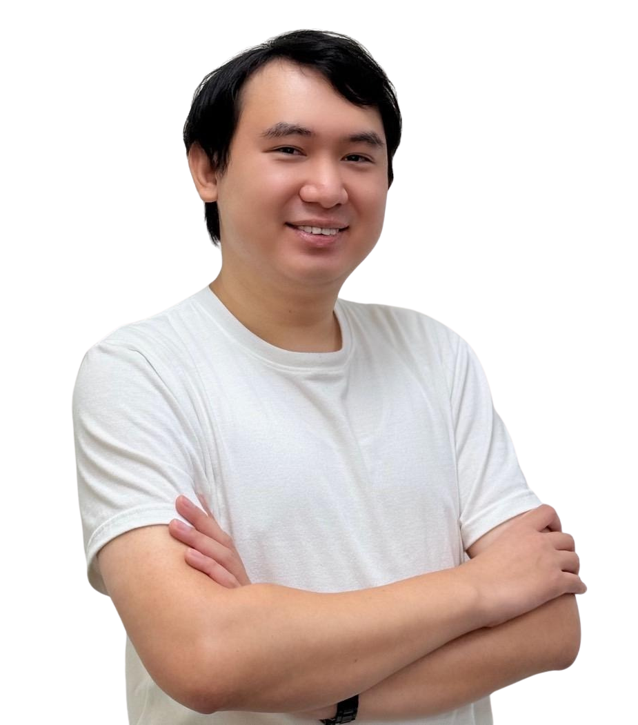 a man in a suit and green shirt is standing in front of a white background .