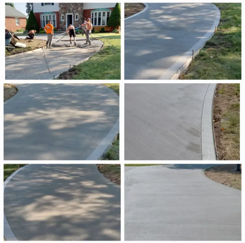 Construction workers pour and level concrete for a driveway in front of a house.