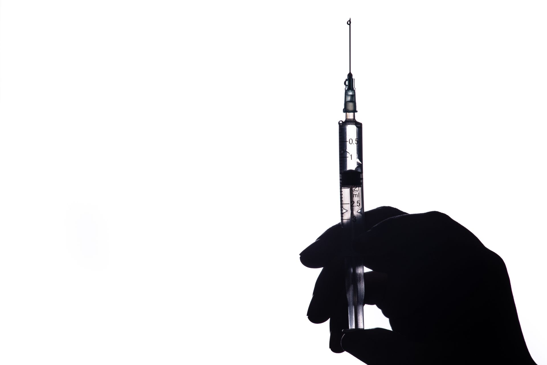 A person is getting an injection in their arm.