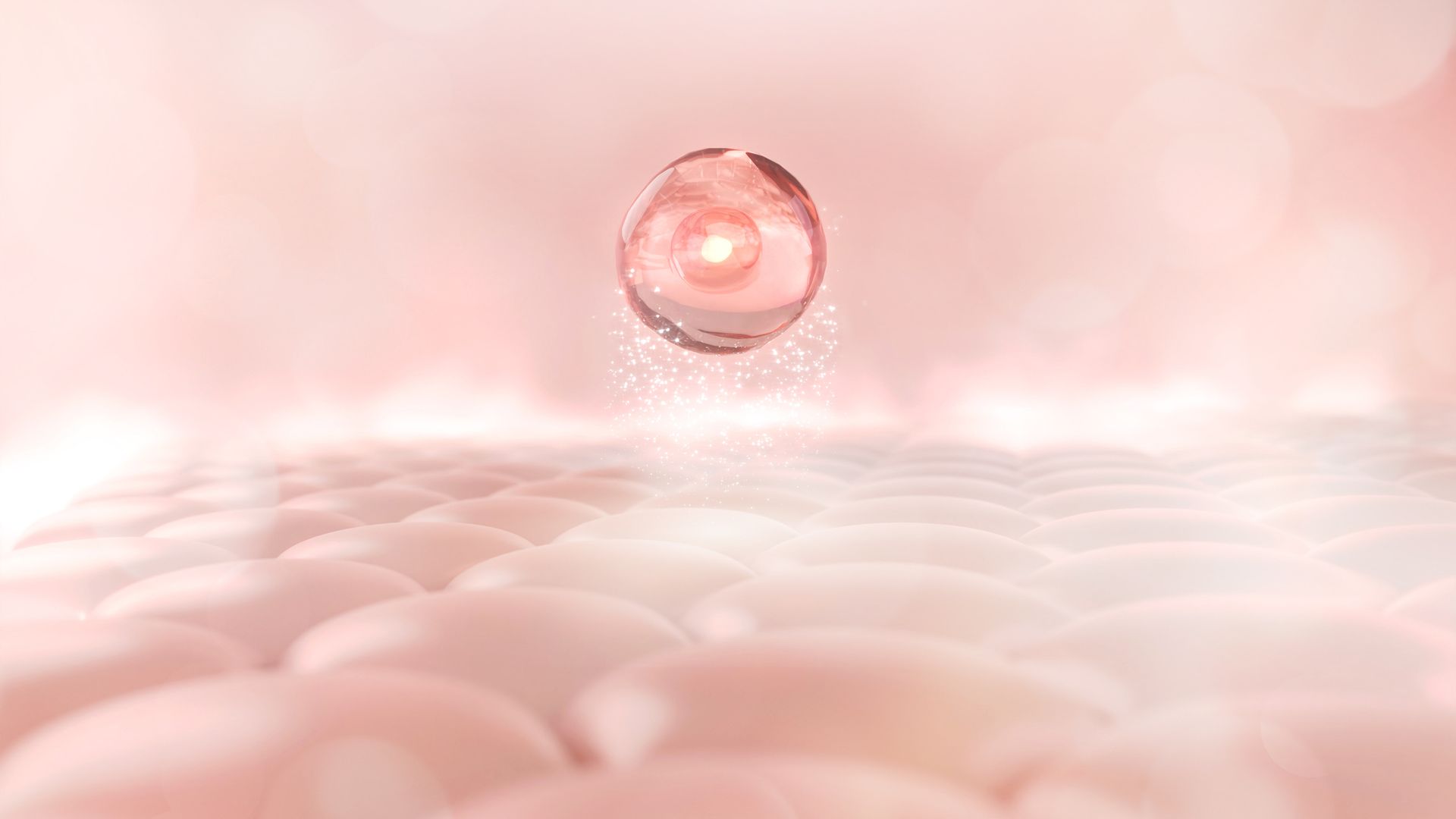 A close up of a drop of water on a pink surface.