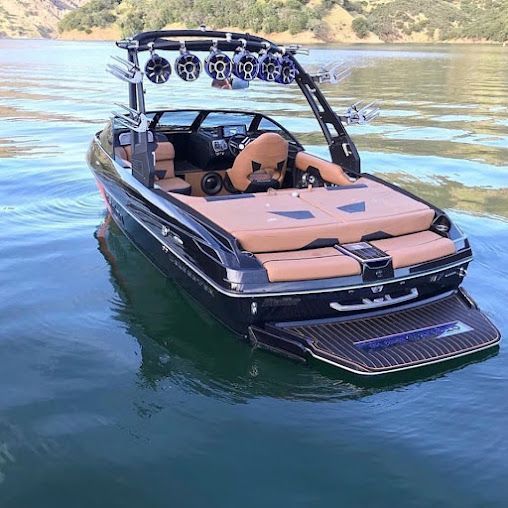 A boat is floating on top of a body of water.