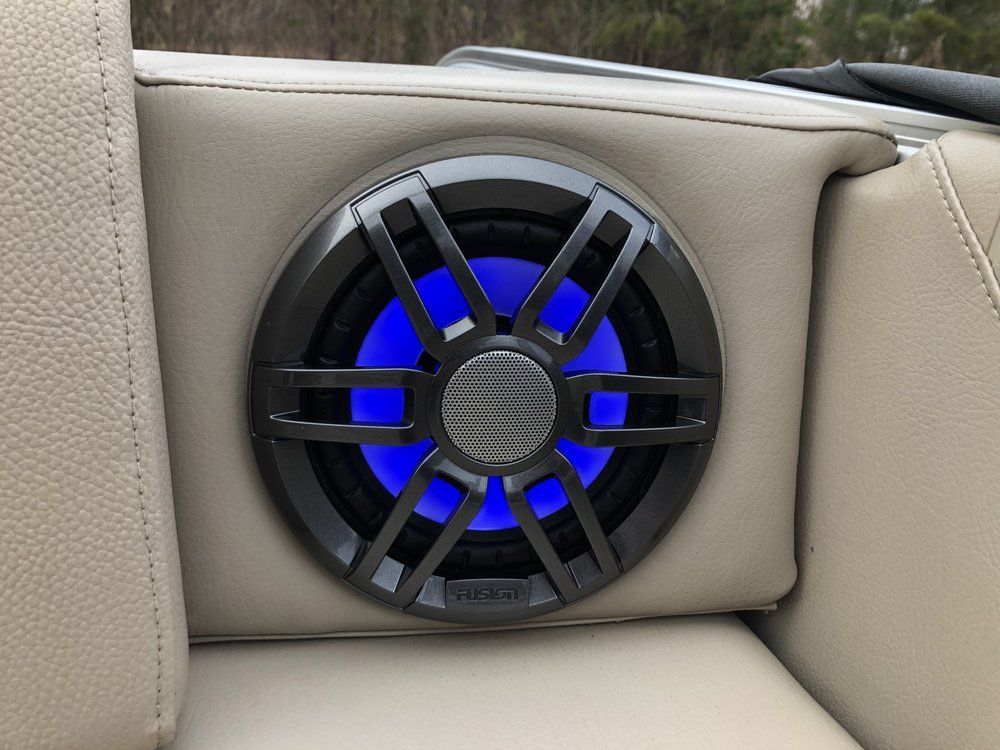 A boat speaker with a blue light on it