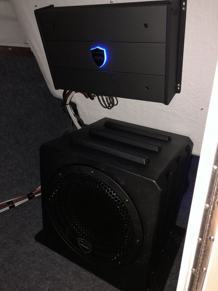 A black box with a blue light on top of it