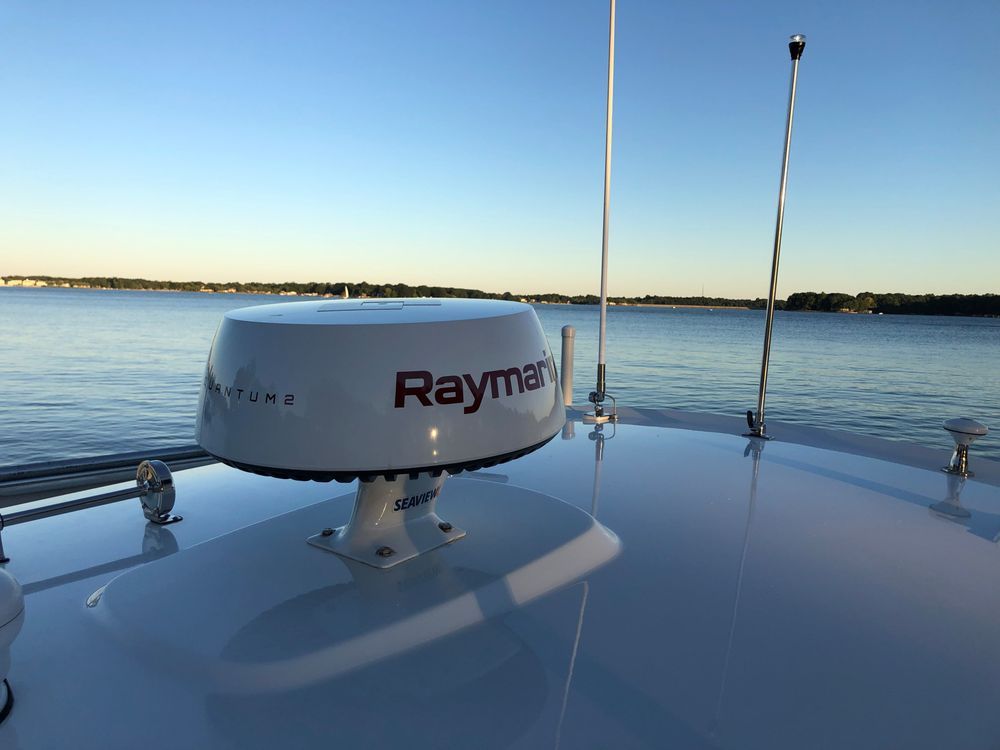 A raymarine antenna on top of a boat