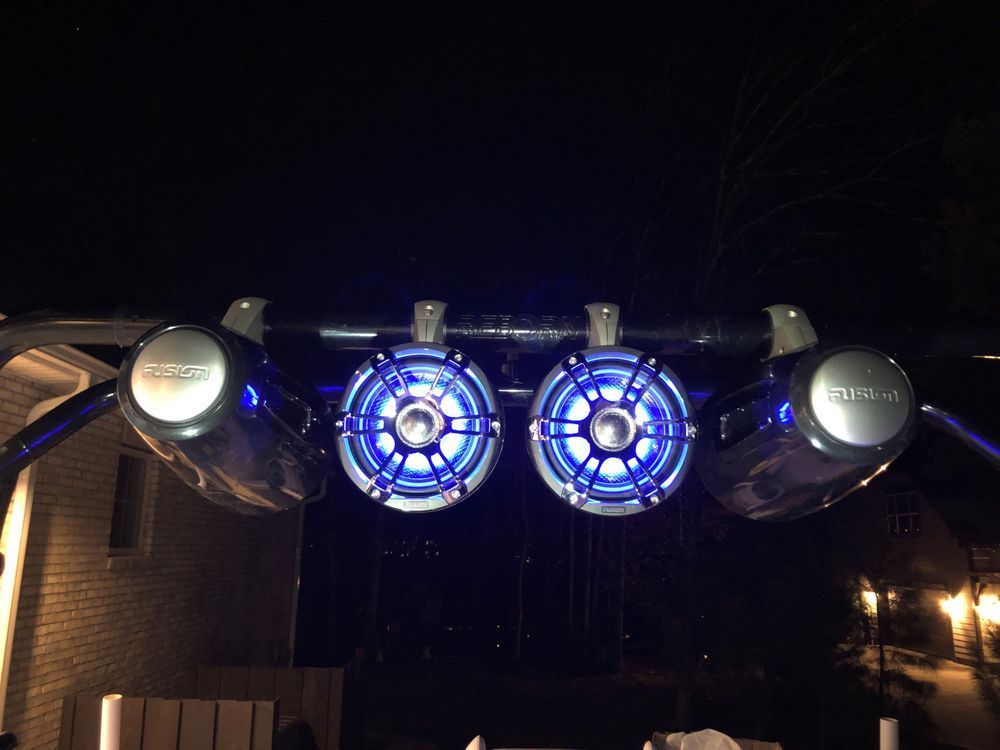 A couple of speakers that are lit up at night