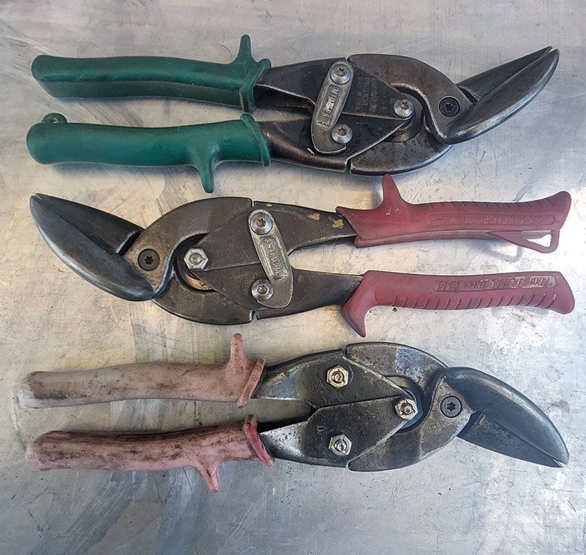 Two Chisels Are Sitting on Top of a Wooden Table — Shaving Sharp Knives And Tools in Centenary Heights, QLD