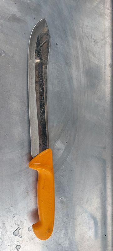 A Kitchen Knife With an Orange Handle — Shaving Sharp Knives And Tools in Warwick, QLD
