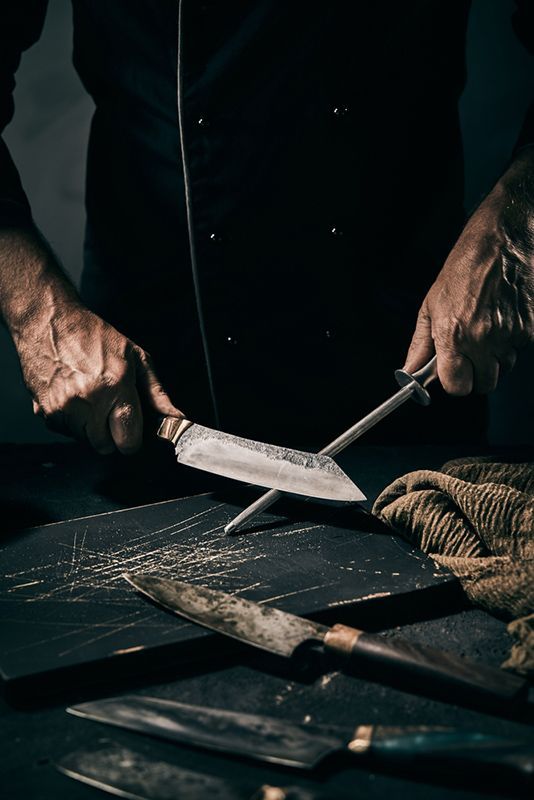 Two Chisels and a Screwdriver Are Sitting on a Wooden Table — Shaving Sharp Knives And Tools in Centenary Heights, QLD
