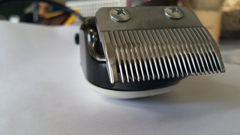 A Close Up Of A Hair Clipper Blade On A White Surface — Shaving Sharp Knives And Tools in Toowoomba, QLD