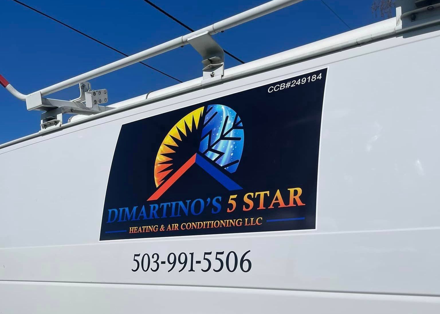 A white van with a sign that says dimartino 's 5 star