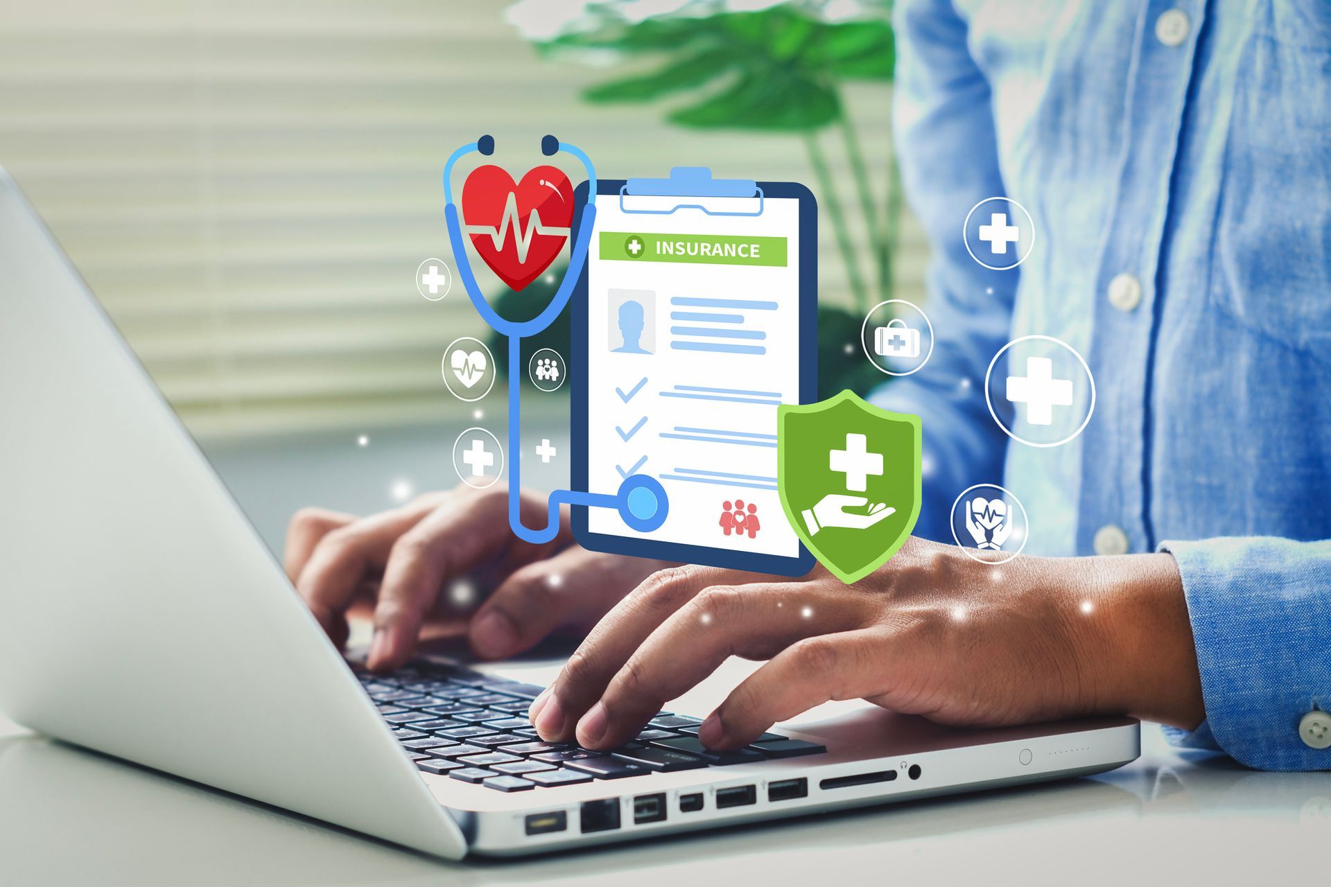 Person using laptop with digital health icons: stethoscope, heart, clipboard, and shield.