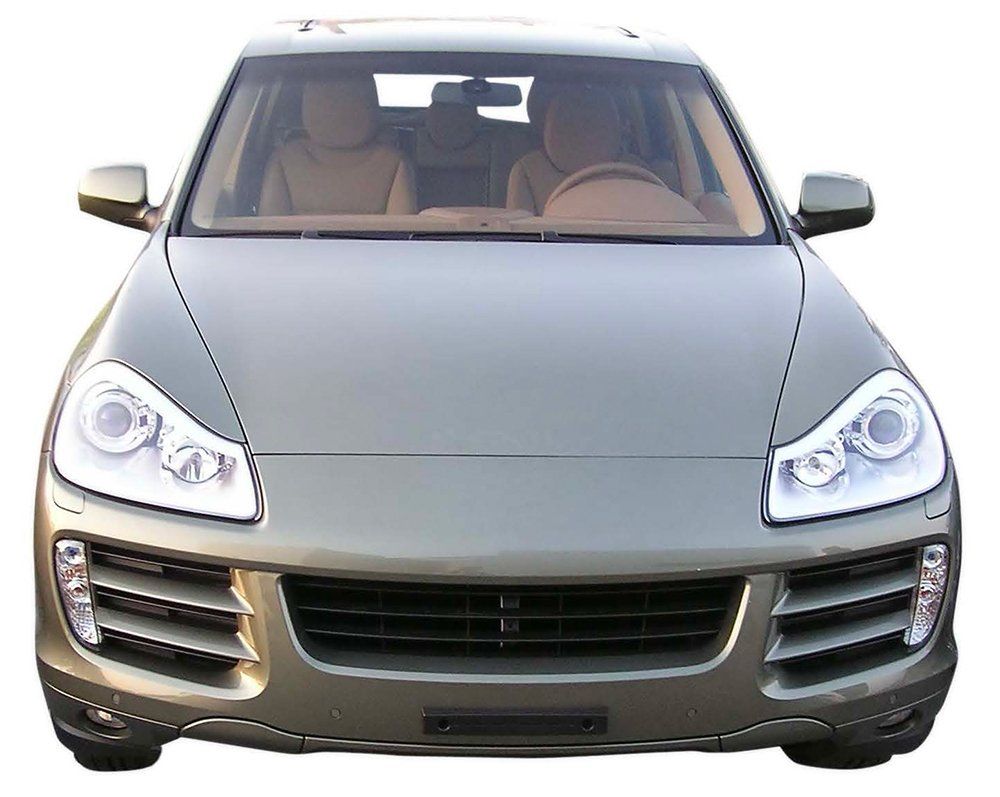 The front of a silver car with a white background