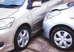 Two cars are parked next to each other on the side of the road.