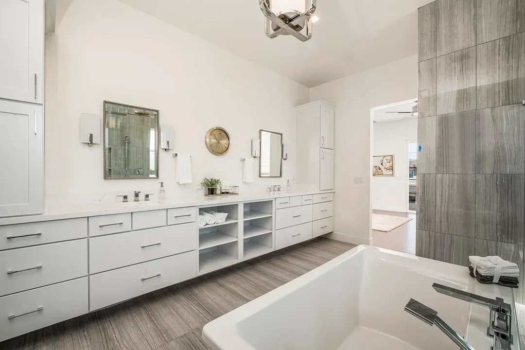 There is a bathtub in the middle of the bathroom.