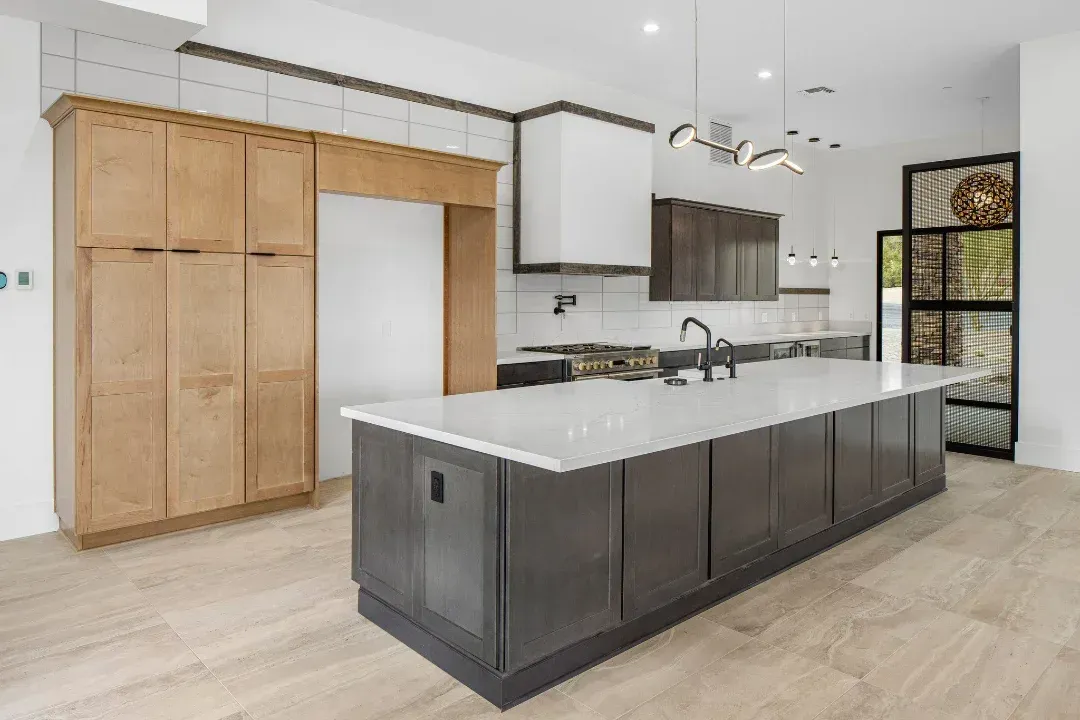 There is a large island in the middle of the kitchen.