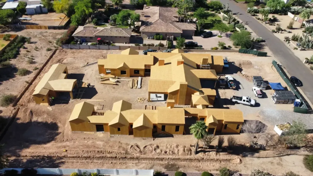 An aerial view of a house under construction in the desert