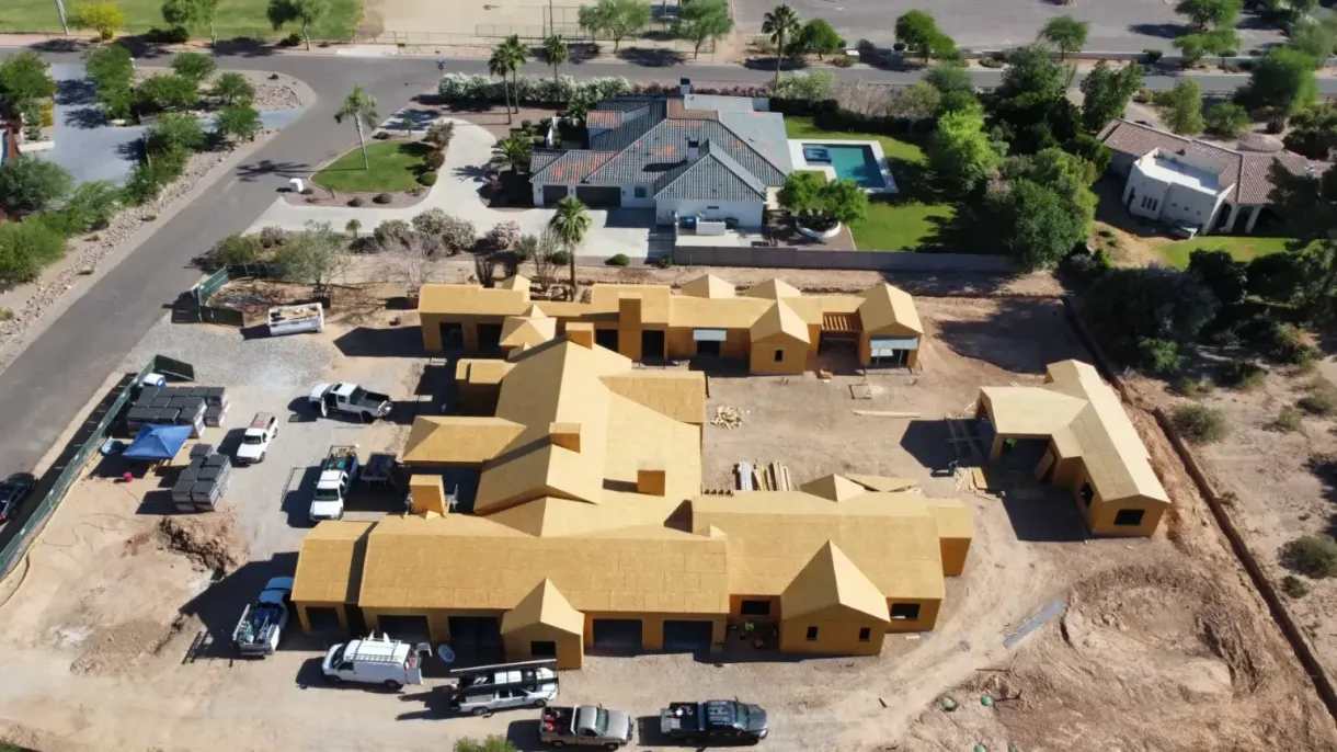 An aerial view of a large house under construction