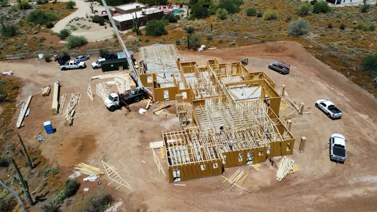 An aerial view of a building under construction in the desert.