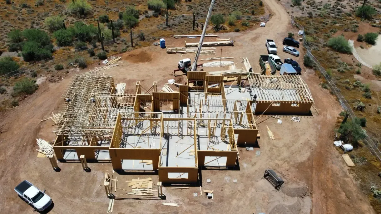 An aerial view of a house under construction in the desert