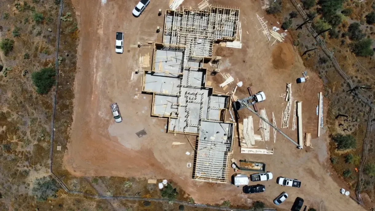 An aerial view of a building under construction in the desert.