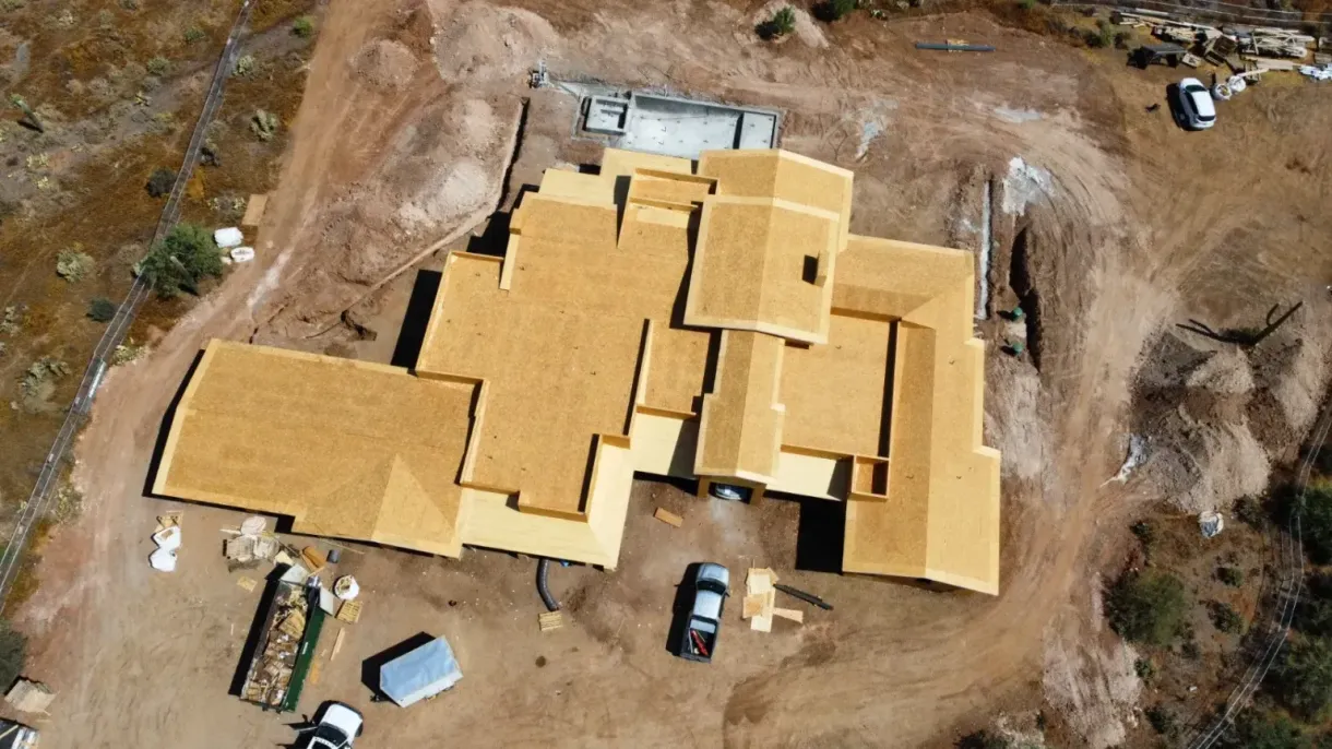 An aerial view of a house under construction in the desert