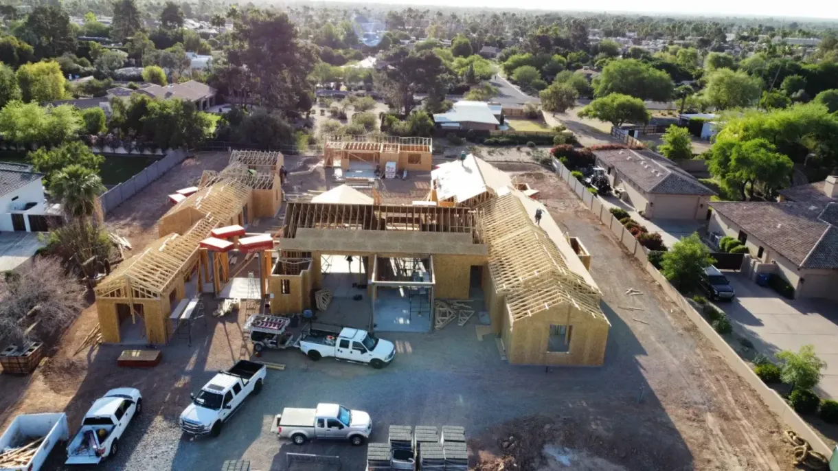 An aerial view of a house under construction in a residential area