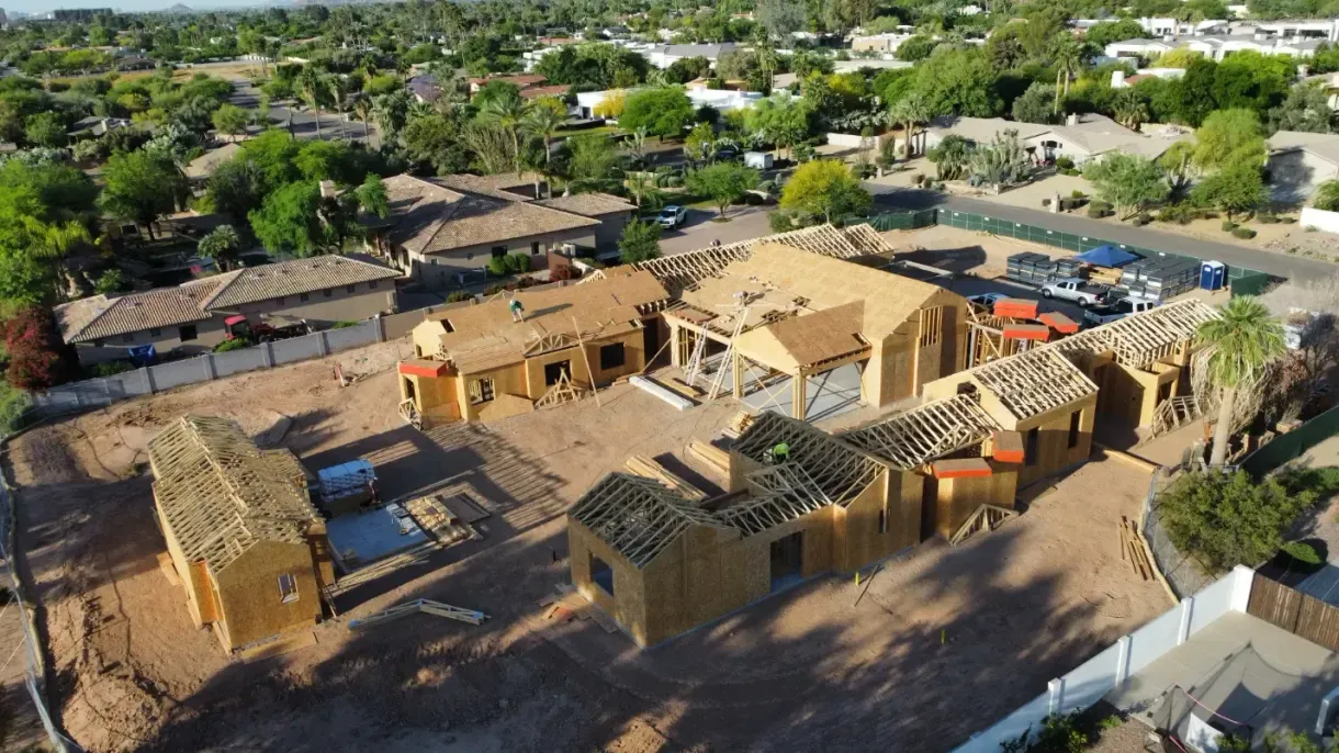 An aerial view of a house under construction in a residential area