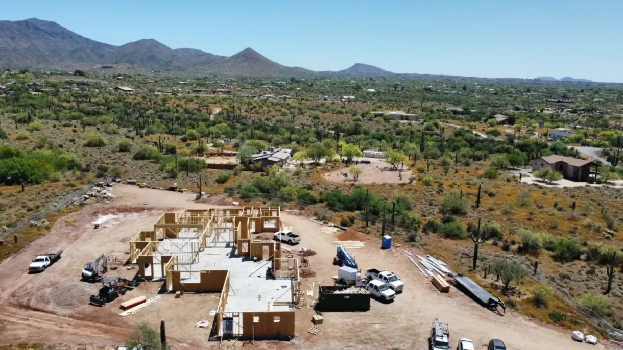 An aerial view of a house under construction in the desert