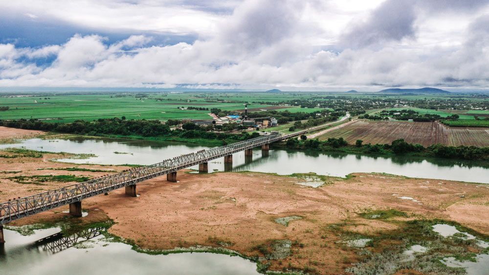 An Aerial View of a Bridge Over a River Surrounded by Fields — 2 Deadly Timber & Lattice in Ayr, QLD