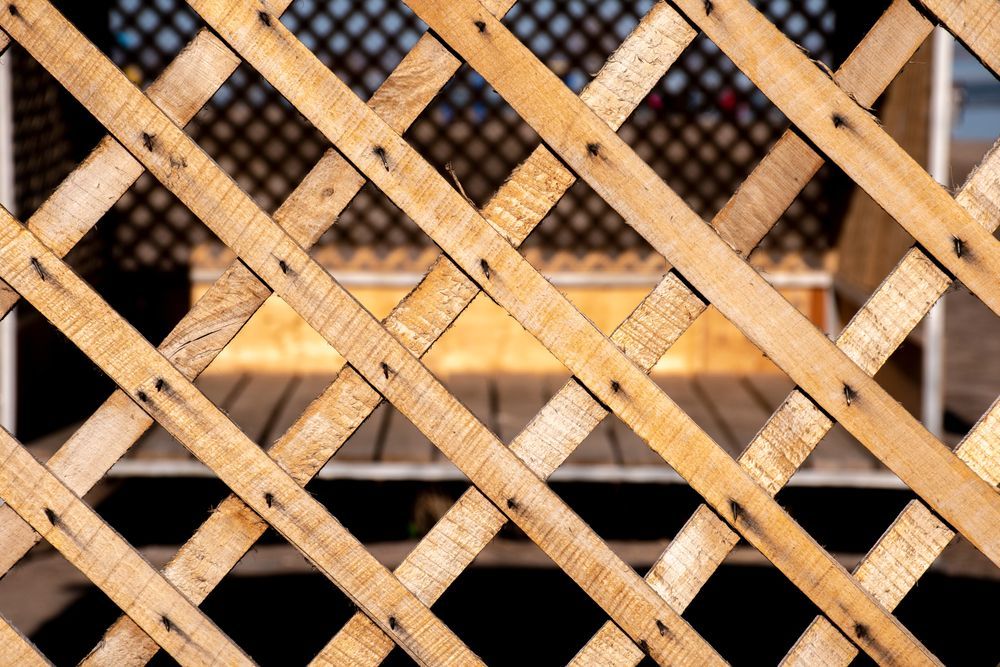A Bunch of Wooden Boards Are Stacked on Top of Each Other on the Ground — 2 Deadly Timber & Lattice in Garbutt, QLD