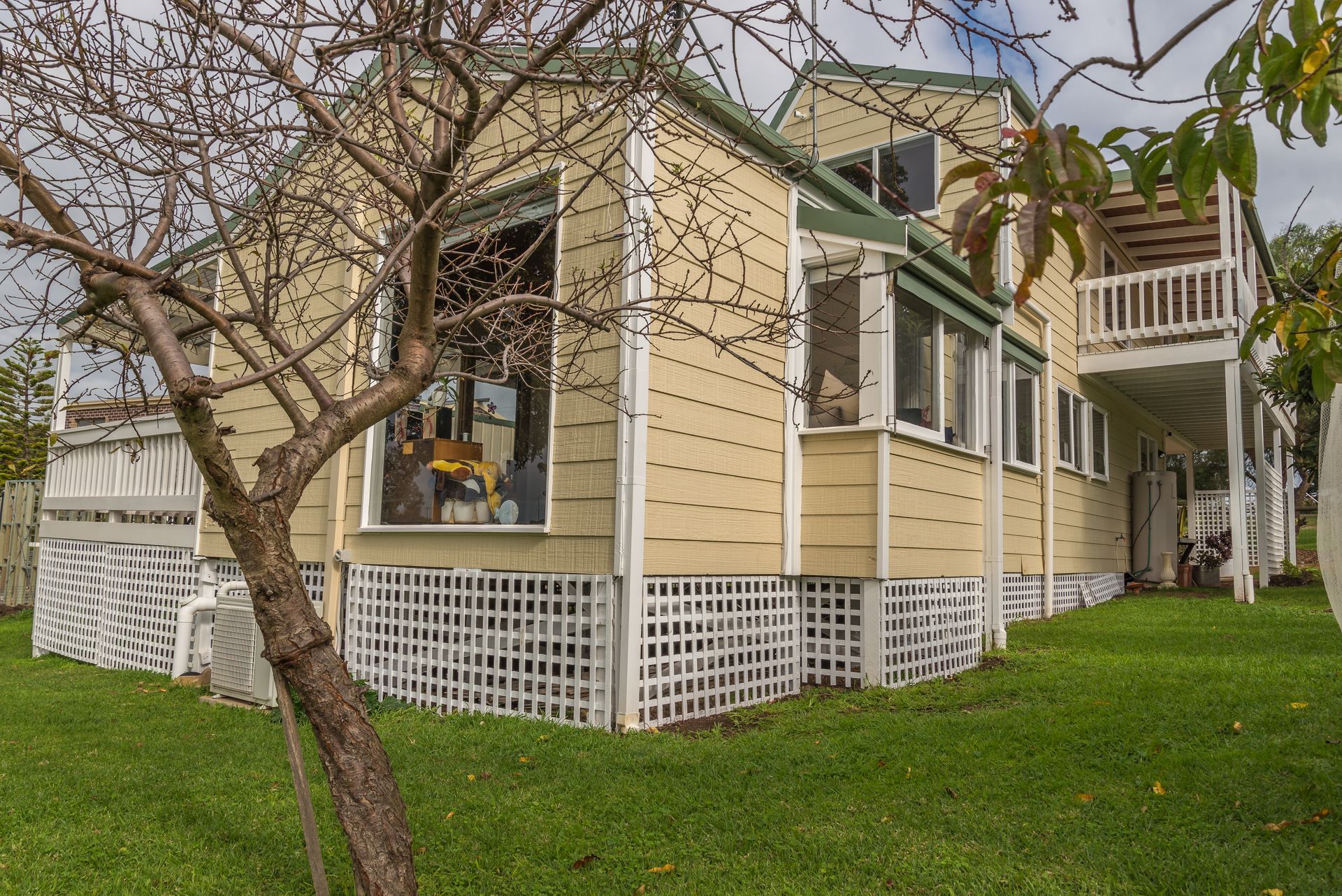 A Wooden Deck With a Fence and a Sunset in the Background — 2 Deadly Timber & Lattice in Garbutt, QLD