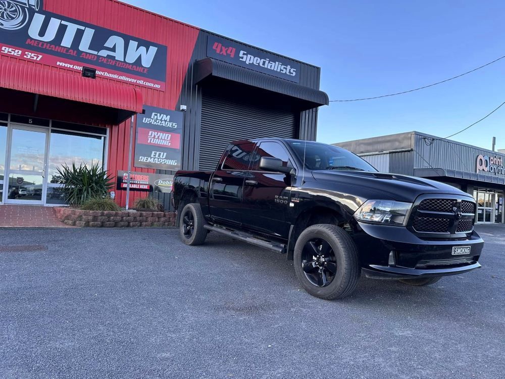 A Black Truck is Parked in Front of a Building — Outlaw Mechanical & Performance In Inverell, NSW