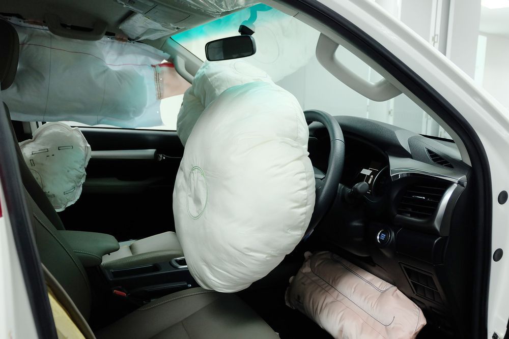 The Inside of a White Car With Airbags on the Seats — Outlaw Mechanical & Performance In Inverell, NSW