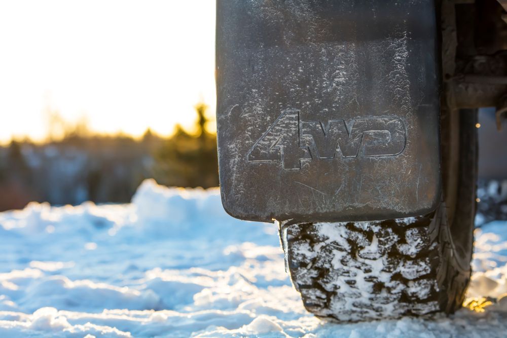 A Close Up of a Tire on a Snowy Road — Outlaw Mechanical & Performance In Inverell, NSW