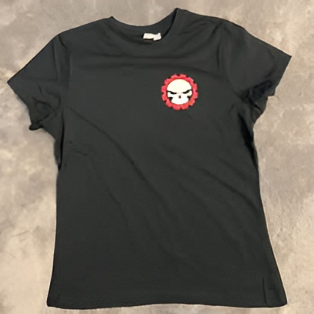 A black t-shirt with a skull on the front — Outlaw Mechanical & Performance In Inverell, NSW